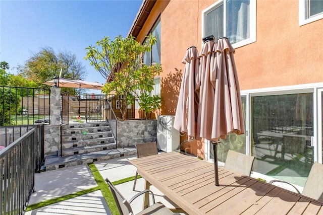 balcony featuring outdoor dining space and a patio area