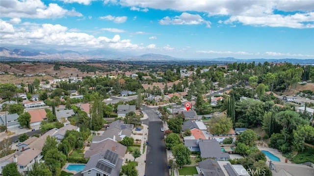 birds eye view of property featuring a mountain view and a residential view
