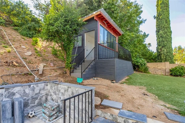 exterior space featuring stairs and fence