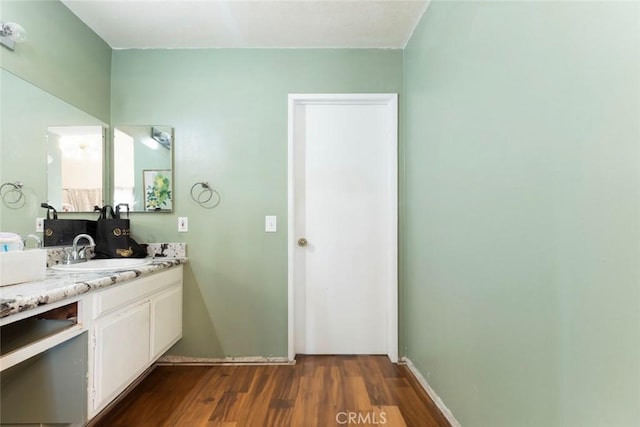 bathroom featuring wood finished floors and vanity