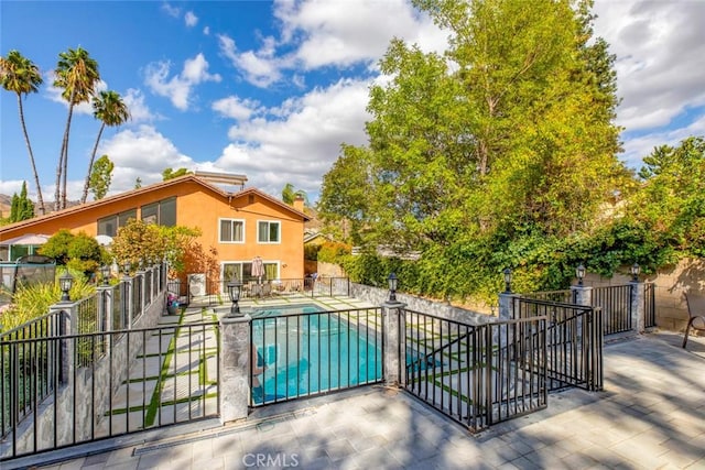 view of pool featuring fence, a patio area, and a fenced in pool