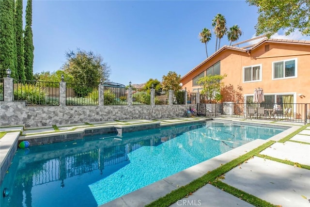 view of pool featuring fence, a patio area, and a fenced in pool