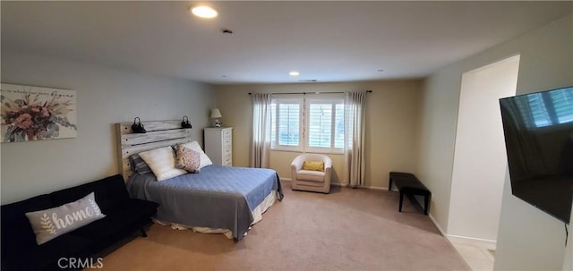 bedroom featuring light colored carpet, recessed lighting, and baseboards