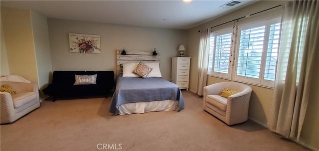 bedroom with carpet flooring and visible vents