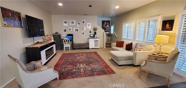 living room featuring carpet floors and recessed lighting