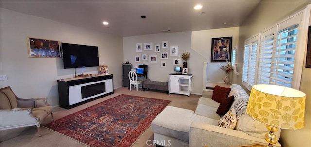 living area featuring carpet floors and recessed lighting