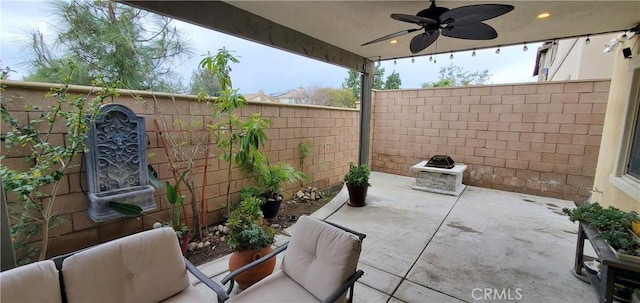 view of patio / terrace featuring a fenced backyard and a ceiling fan