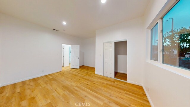 411 W Plum St, Compton, CA 90222 - empty room featuring light wood-style flooring, baseboards, recessed lighting, and vaulted ceiling