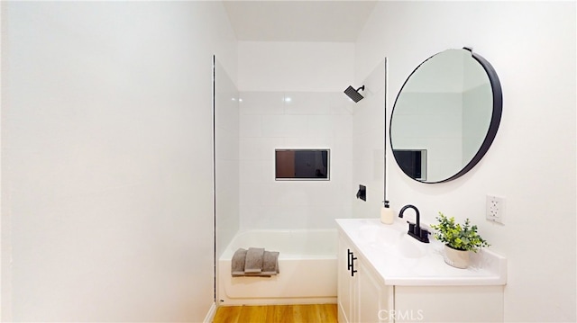 411 W Plum St, Compton, CA 90222 - full bathroom featuring vanity, shower / washtub combination, and wood finished floors