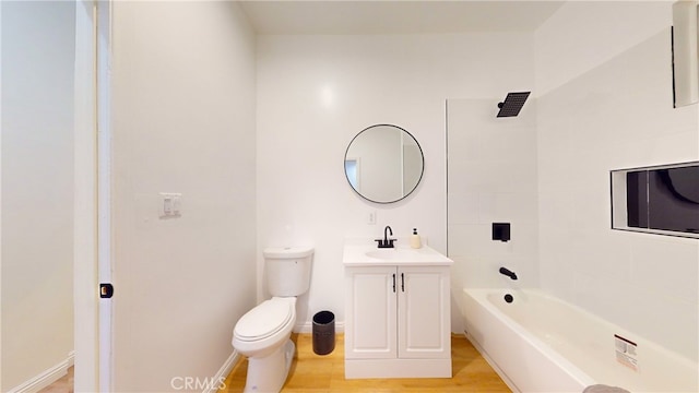 411 W Plum St, Compton, CA 90222 - bathroom featuring toilet, wood finished floors, vanity, and shower / bathtub combination