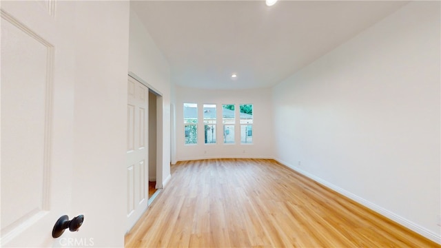 411 W Plum St, Compton, CA 90222 - empty room with light wood-style flooring, recessed lighting, and baseboards