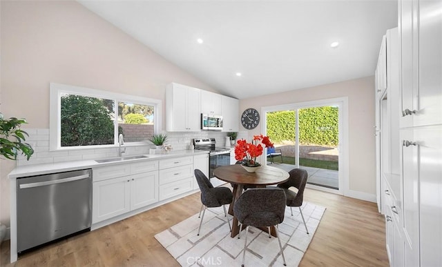 10620 Gemini Dr, Riverside, CA 92503 - dining room featuring light wood-style floors, recessed lighting, and lofted ceiling