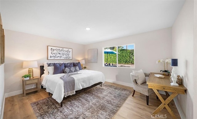10620 Gemini Dr, Riverside, CA 92503 - bedroom featuring light wood-style floors, recessed lighting, and baseboards