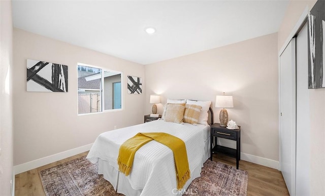 10620 Gemini Dr, Riverside, CA 92503 - bedroom with recessed lighting, baseboards, wood finished floors, and a closet