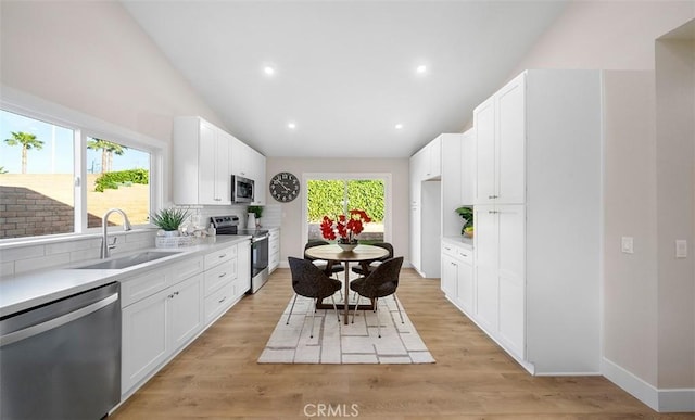 10620 Gemini Dr, Riverside, CA 92503 - kitchen featuring a sink, appliances with stainless steel finishes, tasteful backsplash, and light countertops