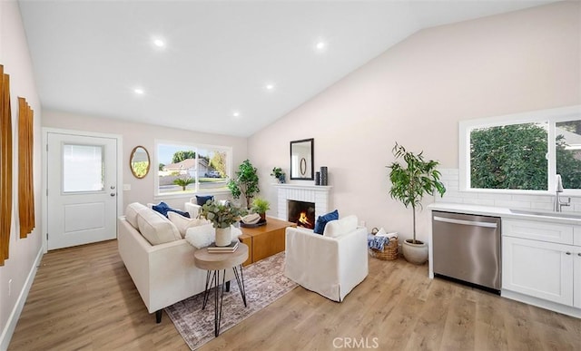 10620 Gemini Dr, Riverside, CA 92503 - living area with recessed lighting, light wood finished floors, high vaulted ceiling, and a fireplace