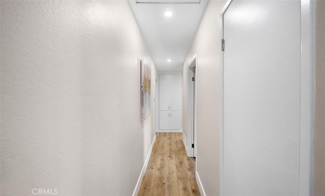 10620 Gemini Dr, Riverside, CA 92503 - hallway featuring light wood-style floors, baseboards, and recessed lighting