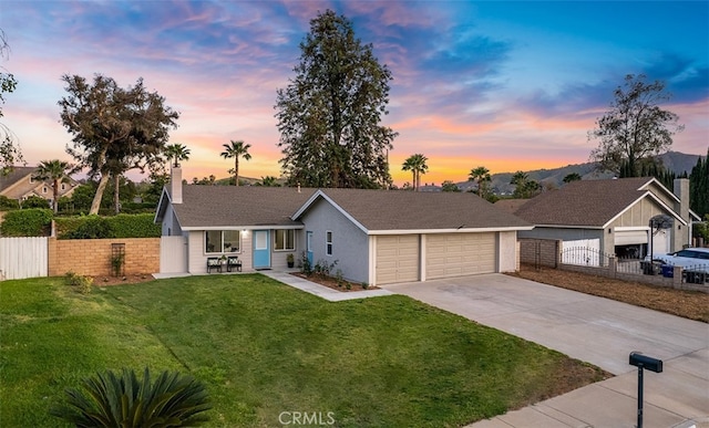 10620 Gemini Dr, Riverside, CA 92503 - ranch-style home featuring a garage, fence, driveway, and a front yard