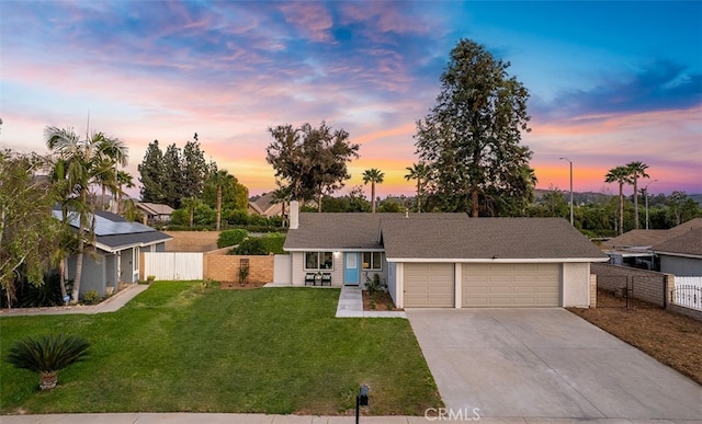 10620 Gemini Dr, Riverside, CA 92503 - mid-century modern home with a garage, a lawn, concrete driveway, and fence