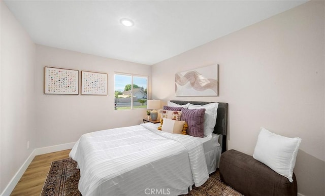 10620 Gemini Dr, Riverside, CA 92503 - bedroom featuring baseboards, recessed lighting, and wood finished floors