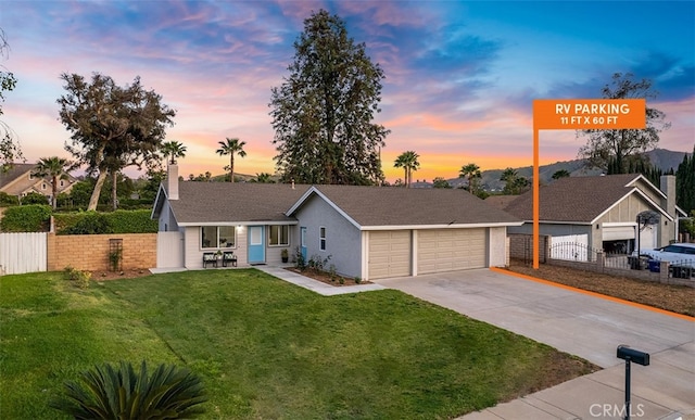 10620 Gemini Dr, Riverside, CA 92503 - ranch-style home featuring a garage, a front lawn, fence, and concrete driveway