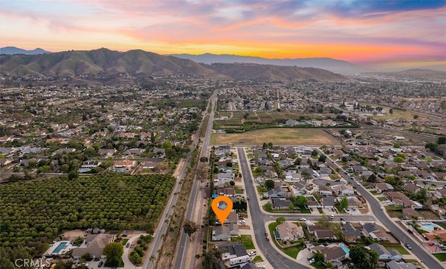 10620 Gemini Dr, Riverside, CA 92503 - aerial view at dusk featuring a residential view and a mountain view
