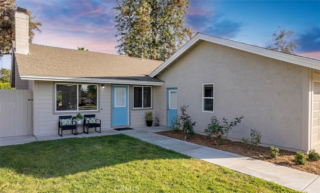 10620 Gemini Dr, Riverside, CA 92503 - ranch-style house with fence, roof with shingles, a chimney, a patio area, and a lawn
