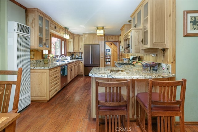 29 Bear Dr, Mt Baldy, CA 91759 - kitchen with light stone counters, light brown cabinetry, a peninsula, dark wood-style floors, and stainless steel appliances