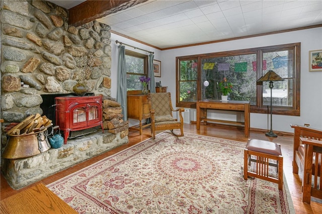 29 Bear Dr, Mt Baldy, CA 91759 - living area with wood finished floors, crown molding, and a wood stove
