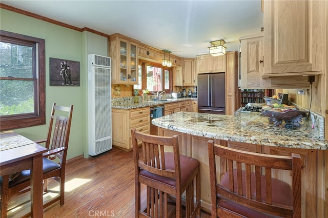 29 Bear Dr, Mt Baldy, CA 91759 - kitchen with a peninsula, plenty of natural light, wood finished floors, stainless steel appliances, and glass insert cabinets