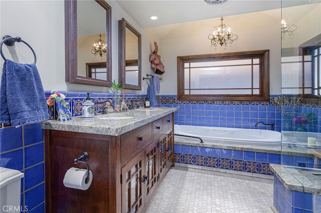 29 Bear Dr, Mt Baldy, CA 91759 - bathroom with tile walls, a notable chandelier, tile patterned flooring, and a sink