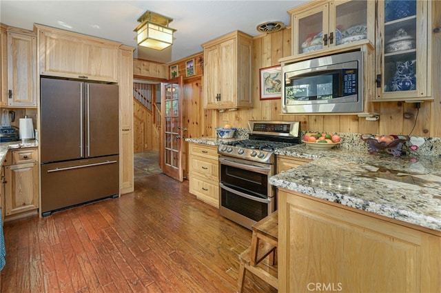 29 Bear Dr, Mt Baldy, CA 91759 - kitchen featuring wood walls, light brown cabinetry, and stainless steel appliances