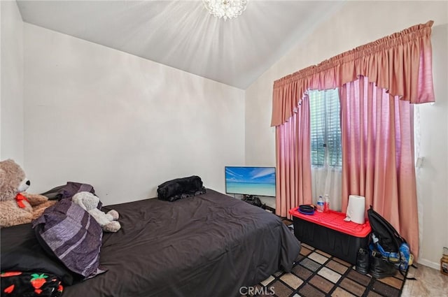 bedroom featuring vaulted ceiling