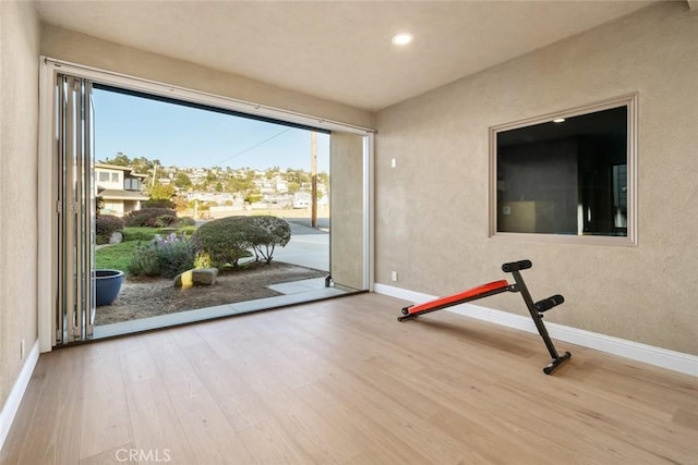 2062 Sherwood Dr, Cambria, CA 93428 - workout area featuring wood finished floors, baseboards, recessed lighting, and a textured wall
