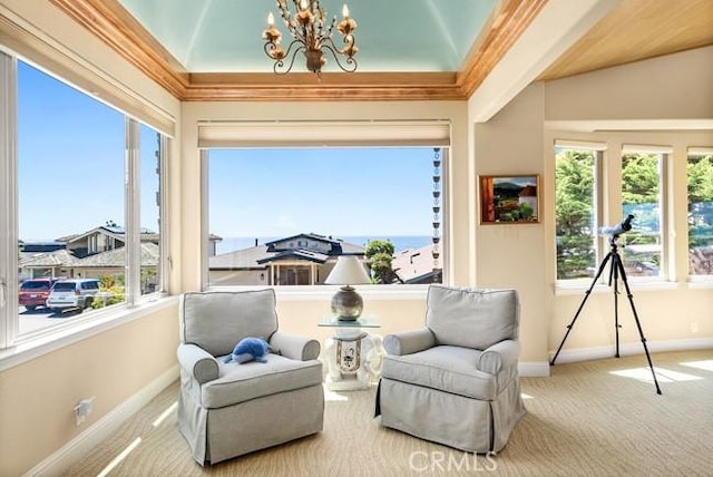2062 Sherwood Dr, Cambria, CA 93428 - living area with carpet, healthy amount of natural light, a chandelier, baseboards, and vaulted ceiling