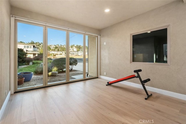 2062 Sherwood Dr, Cambria, CA 93428 - exercise area featuring baseboards, wood finished floors, and recessed lighting