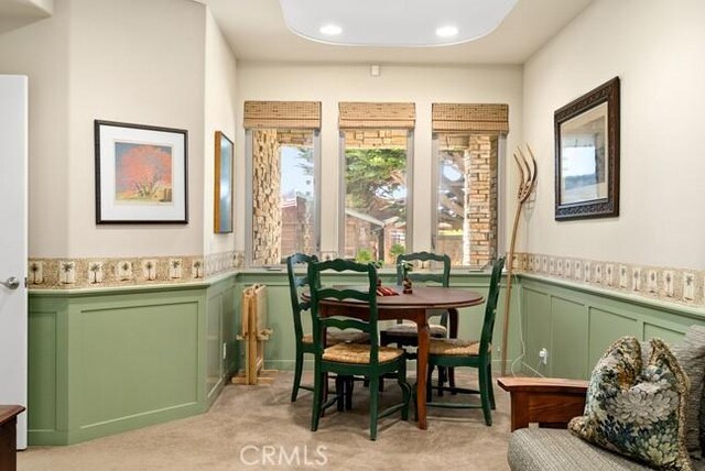 2062 Sherwood Dr, Cambria, CA 93428 - dining room with a wainscoted wall, light carpet, recessed lighting, and a decorative wall