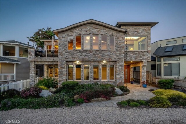 2062 Sherwood Dr, Cambria, CA 93428 - back of house featuring stone siding and a balcony