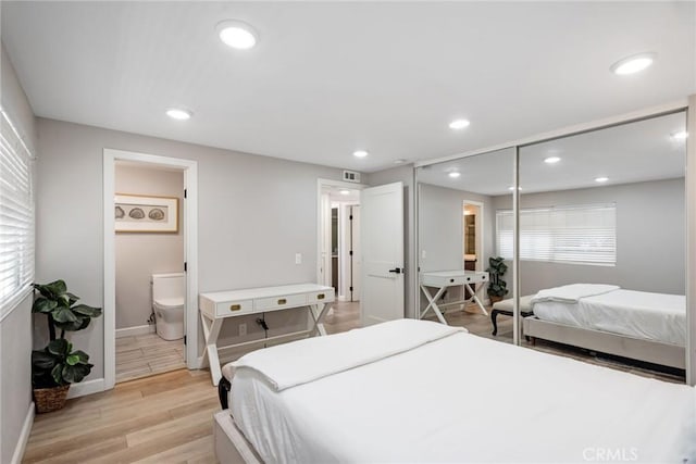 2208 The Strand, Manhattan Beach, CA 90266 - bedroom with visible vents, baseboards, recessed lighting, light wood-style floors, and a closet