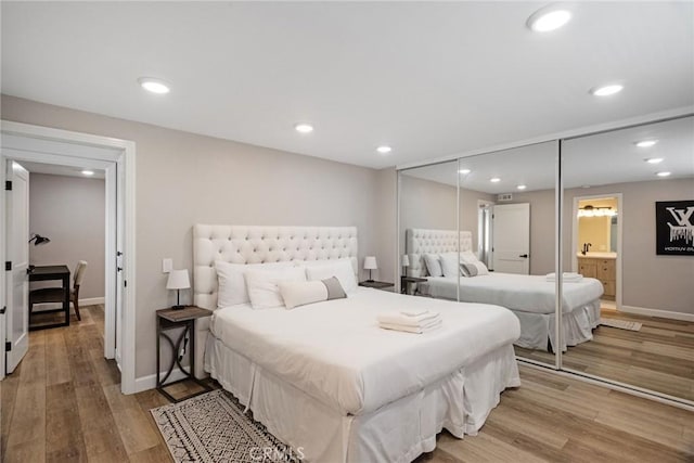 2208 The Strand, Manhattan Beach, CA 90266 - bedroom with recessed lighting, light wood-style floors, baseboards, and a sink