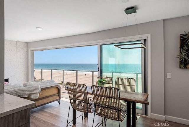 2208 The Strand, Manhattan Beach, CA 90266 - dining space with baseboards, wood finished floors, a view of the beach, and a water view