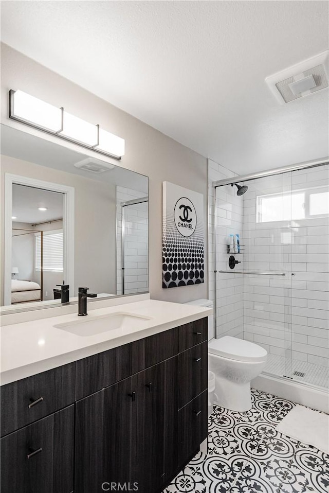 2208 The Strand, Manhattan Beach, CA 90266 - full bathroom featuring a stall shower, vanity, toilet, tile patterned flooring, and visible vents