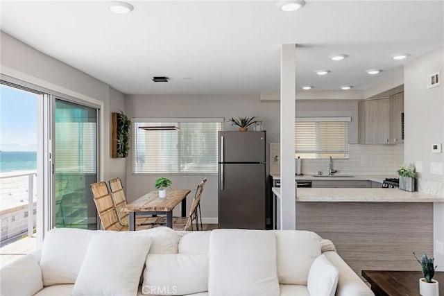 2208 The Strand, Manhattan Beach, CA 90266 - interior space with recessed lighting, a water view, and baseboards