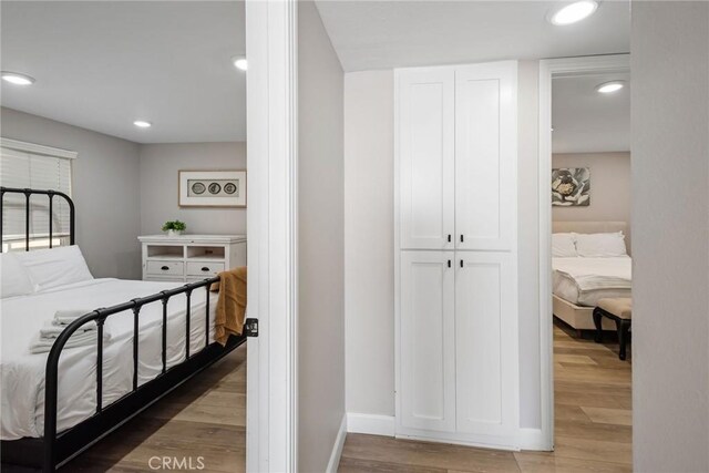 2208 The Strand, Manhattan Beach, CA 90266 - bedroom featuring baseboards, light wood-style floors, and recessed lighting