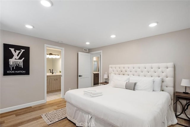2208 The Strand, Manhattan Beach, CA 90266 - bedroom featuring recessed lighting, light wood finished floors, connected bathroom, a sink, and baseboards