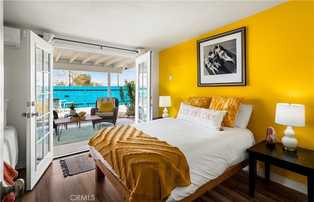 72994 Homestead Dr Unit 29, Palms, CA 92277 - bedroom with access to outside, a wall mounted air conditioner, wood finished floors, and french doors