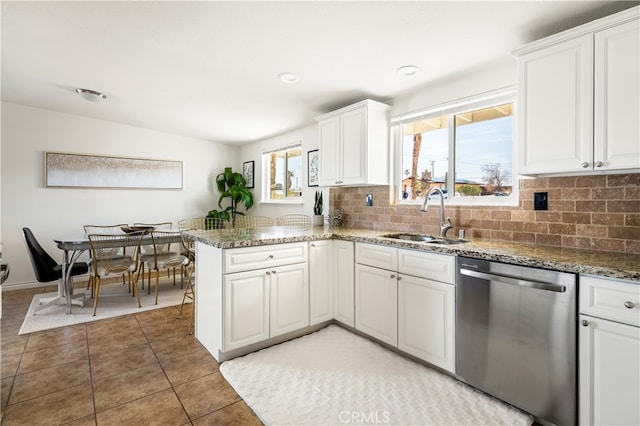 72994 Homestead Dr Unit 29, Palms, CA 92277 - kitchen with dishwasher, tasteful backsplash, a peninsula, white cabinetry, and light stone countertops