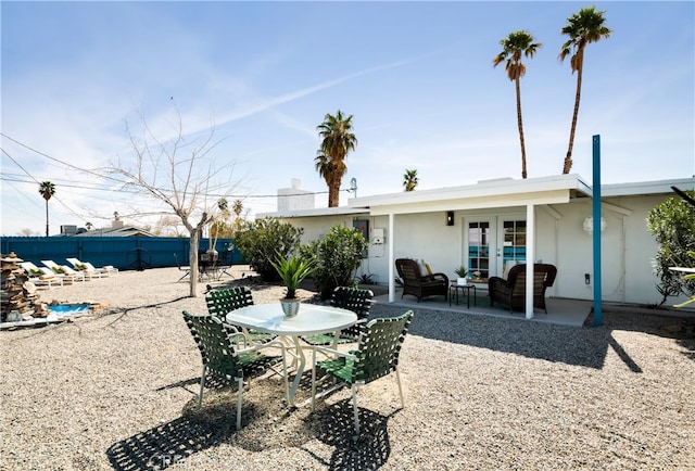 72994 Homestead Dr Unit 29, Palms, CA 92277 - view of patio / terrace with french doors and an outdoor living space