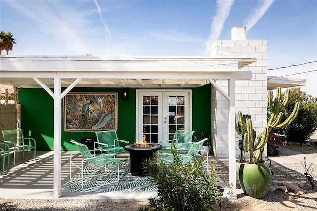 72994 Homestead Dr Unit 29, Palms, CA 92277 - view of patio with an outdoor fire pit and french doors