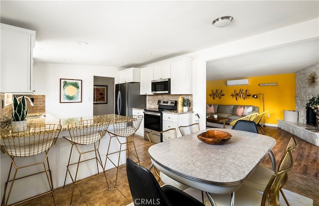72994 Homestead Dr Unit 29, Palms, CA 92277 - dining area with a large fireplace